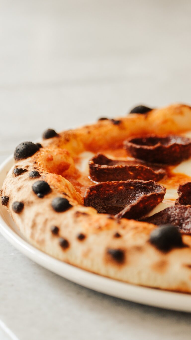 Brick-oven pizza with charred crust